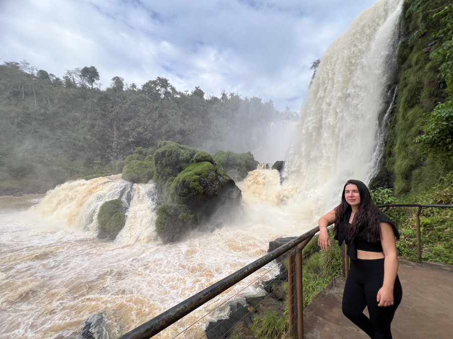 Girl by waterfall in Paraguay